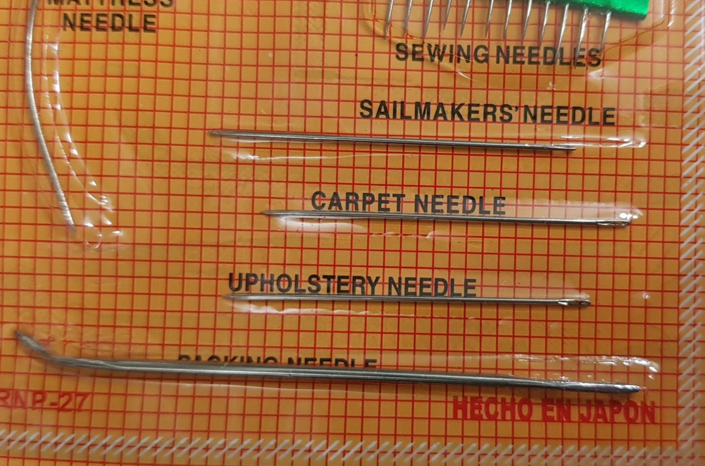 Sewing needle set. With 26 needles and threaders